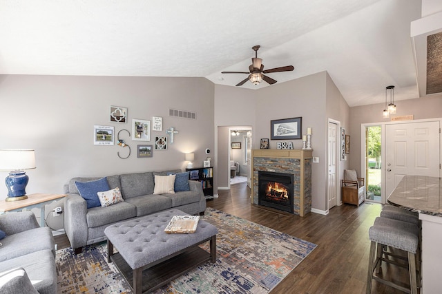 4465 Spinnaker Ln, Pleasant Lake, MI 49272 - living area with a ceiling fan, dark wood finished floors, a fireplace, high vaulted ceiling, and baseboards