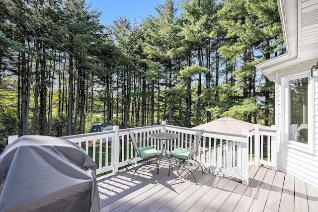 4465 Spinnaker Ln, Pleasant Lake, MI 49272 - wooden deck featuring view of scattered trees and grilling area