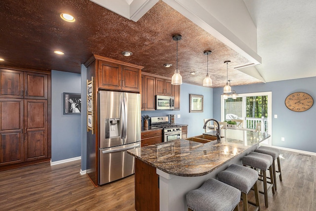 4465 Spinnaker Ln, Pleasant Lake, MI 49272 - kitchen featuring appliances with stainless steel finishes, baseboards, a sink, dark wood-style floors, and recessed lighting