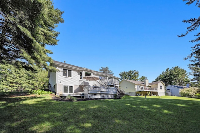 4465 Spinnaker Ln, Pleasant Lake, MI 49272 - rear view of house featuring a lawn and a wooden deck