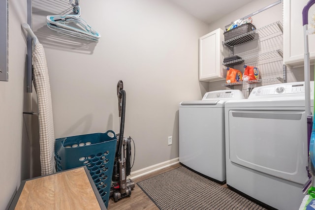 4465 Spinnaker Ln, Pleasant Lake, MI 49272 - washroom featuring cabinet space, separate washer and dryer, baseboards, and wood finished floors