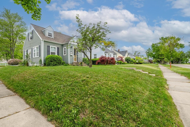 2630 Willa Dr, Saint Joseph, MI 49085 - view of front of property featuring a front yard and a shingled roof