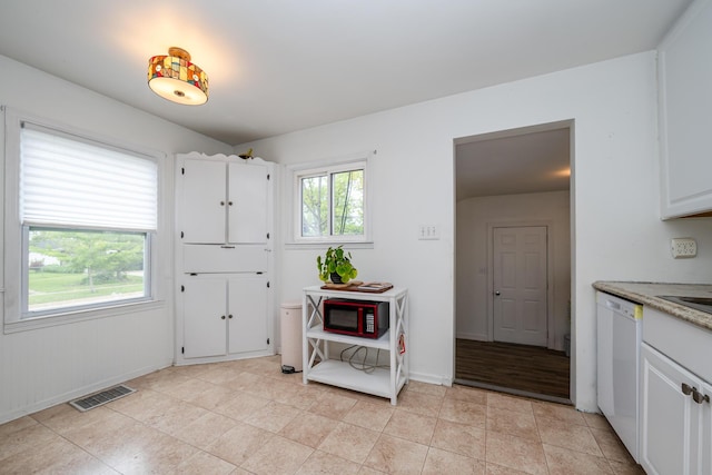 2630 Willa Dr, Saint Joseph, MI 49085 - kitchen with dishwasher, white cabinetry, and light stone counters