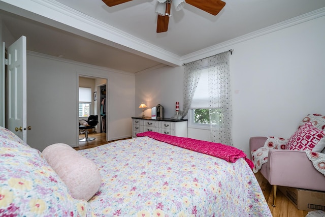 2630 Willa Dr, Saint Joseph, MI 49085 - bedroom with crown molding, wood finished floors, ceiling fan, and a closet