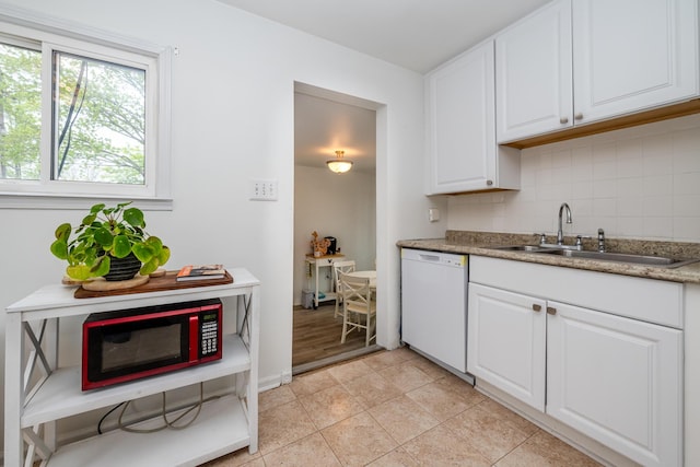 2630 Willa Dr, Saint Joseph, MI 49085 - kitchen with white appliances, a sink, tasteful backsplash, white cabinets, and light tile patterned floors