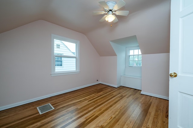 2630 Willa Dr, Saint Joseph, MI 49085 - additional living space featuring light wood finished floors, lofted ceiling, ceiling fan, and baseboards