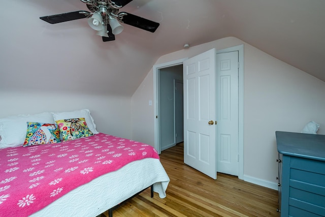 2630 Willa Dr, Saint Joseph, MI 49085 - bedroom with wood finished floors, vaulted ceiling, and ceiling fan
