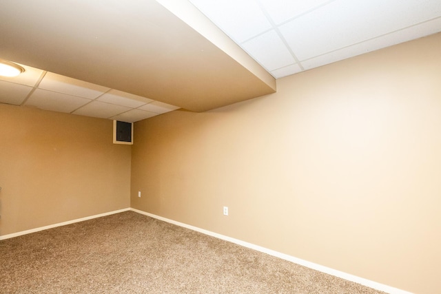 2630 Willa Dr, Saint Joseph, MI 49085 - finished basement featuring a drop ceiling, carpet floors, and baseboards