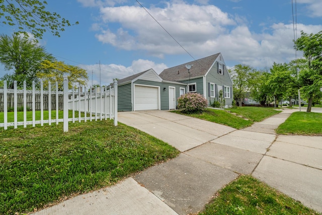 2630 Willa Dr, Saint Joseph, MI 49085 - view of property exterior with driveway, a garage, and roof with shingles