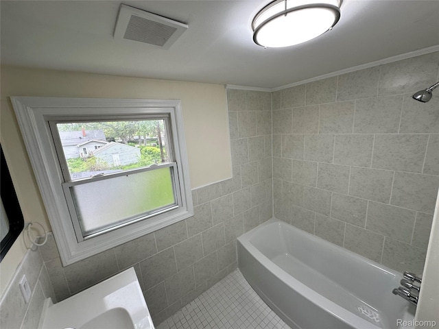 33050 John Hauk St, Garden City, MI 48135 - bathroom featuring tile walls, tile patterned floors, and tub / shower combination