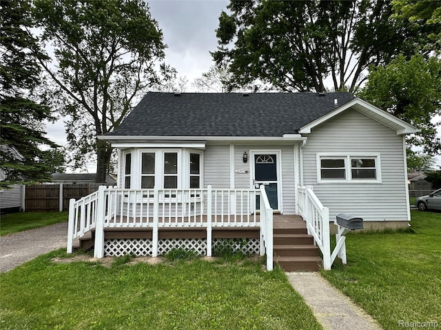 33050 John Hauk St, Garden City, MI 48135 - view of front facade featuring a wooden deck and a shingled roof