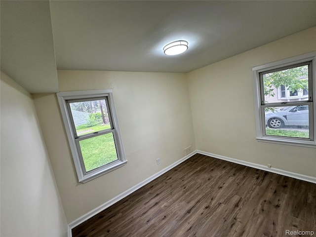 33050 John Hauk St, Garden City, MI 48135 - empty room with dark wood-type flooring and baseboards