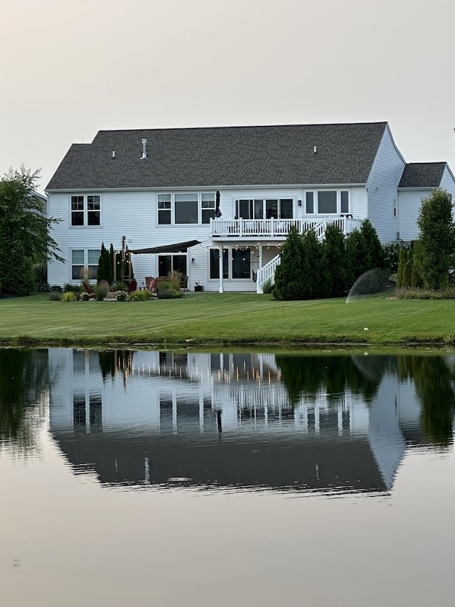 13944 Harrington Lndg, Holland, MI 49424 - back of house with a water view and a yard