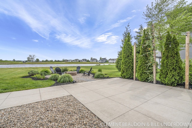 13944 Harrington Lndg, Holland, MI 49424 - view of patio featuring an outdoor fire pit and a water view