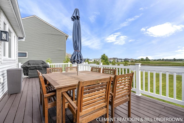 13944 Harrington Lndg, Holland, MI 49424 - wooden terrace with outdoor dining area, grilling area, and a lawn