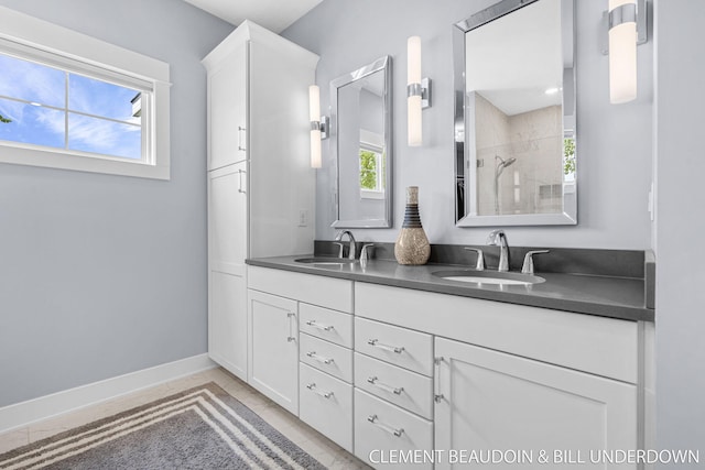 13944 Harrington Lndg, Holland, MI 49424 - full bath featuring double vanity, tiled shower, and baseboards