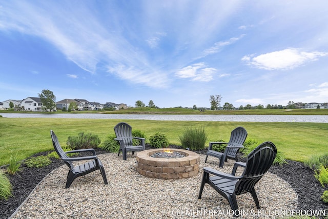13944 Harrington Lndg, Holland, MI 49424 - view of patio featuring a fire pit, a water view, and a residential view