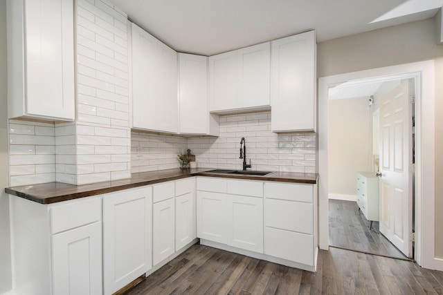1538 Rossman Ave SE, Grand Rapids, MI 49507 - kitchen with a sink, tasteful backsplash, white cabinets, and butcher block countertops