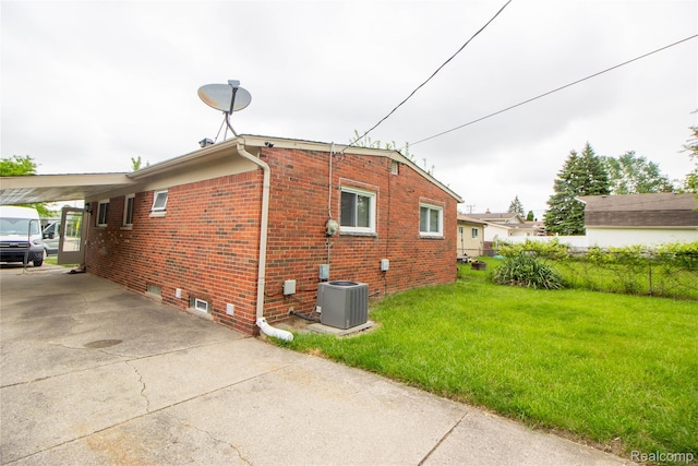 30779 Bennington St, Westland, MI 48186 - view of property exterior featuring central AC unit, brick siding, concrete driveway, and an attached carport
