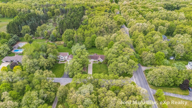 13 Foleys Grade, Lowell, MI 49331 - aerial overview of property's location featuring a heavily wooded area