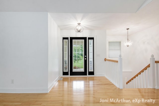 13 Foleys Grade, Lowell, MI 49331 - foyer entrance with a chandelier, wood finished floors, and baseboards