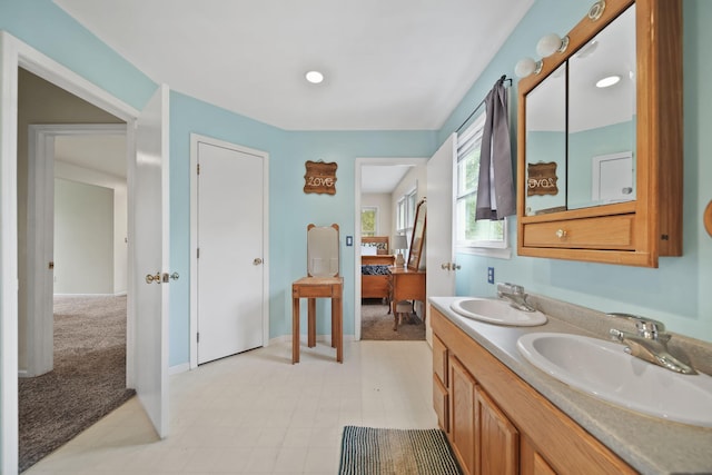9428 Talladay Rd, Willis, MI 48191 - bathroom with double vanity and baseboards