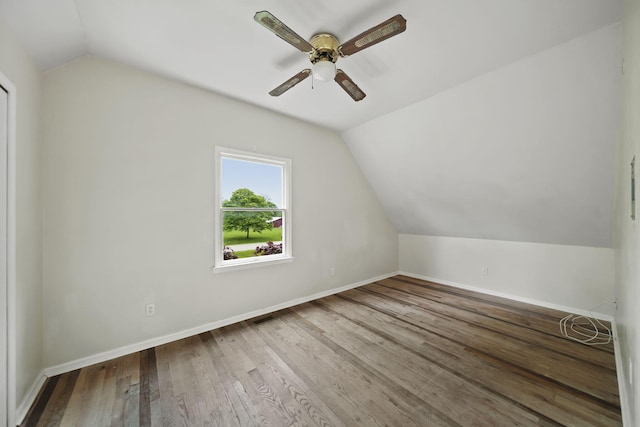 9428 Talladay Rd, Willis, MI 48191 - additional living space with lofted ceiling, a ceiling fan, wood finished floors, and baseboards