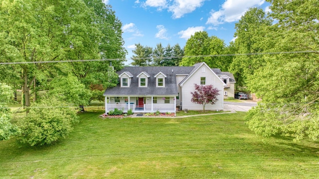 9428 Talladay Rd, Willis, MI 48191 - cape cod-style house featuring covered porch, a front lawn, and view of scattered trees