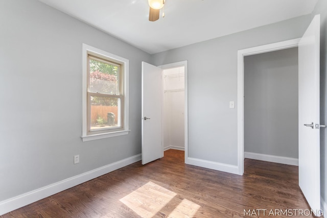 1272 Den Hertog St SW, Wyoming, MI 49509 - unfurnished bedroom with wood finished floors, baseboards, a closet, and ceiling fan