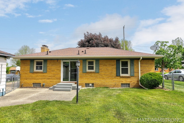 1272 Den Hertog St SW, Wyoming, MI 49509 - rear view of property with entry steps, a chimney, brick siding, a patio area, and roof with shingles