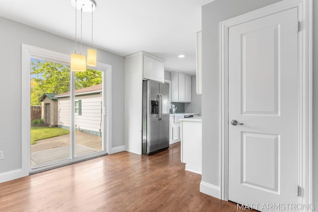 1272 Den Hertog St SW, Wyoming, MI 49509 - kitchen featuring stainless steel refrigerator with ice dispenser, light countertops, dark wood finished floors, baseboards, and recessed lighting
