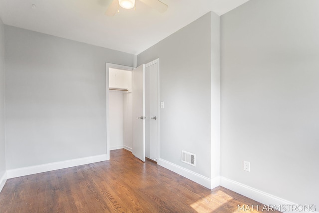 1272 Den Hertog St SW, Wyoming, MI 49509 - unfurnished bedroom featuring baseboards, wood finished floors, a closet, and a ceiling fan
