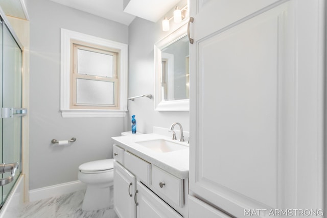 1272 Den Hertog St SW, Wyoming, MI 49509 - bathroom featuring baseboards, vanity, marble finish floors, toilet, and shower / bath combination with glass door