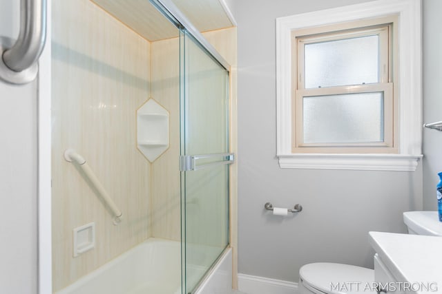 1272 Den Hertog St SW, Wyoming, MI 49509 - full bathroom featuring vanity, toilet, baseboards, and enclosed tub / shower combo