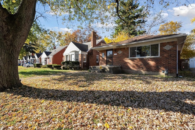 11359 Braile St, Detroit, MI 48228 - bungalow-style home with brick siding, a chimney, and cooling unit