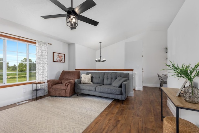 1443 140th Ave, Wayland, MI 49348 - living room featuring a chandelier, baseboards, vaulted ceiling, dark wood finished floors, and a ceiling fan