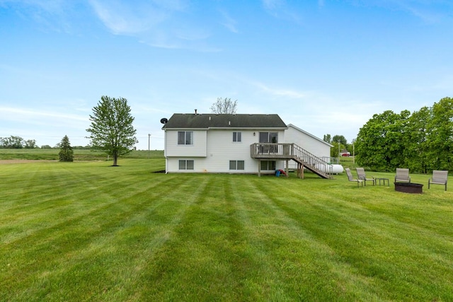 1443 140th Ave, Wayland, MI 49348 - rear view of house with stairway, a lawn, and a wooden deck