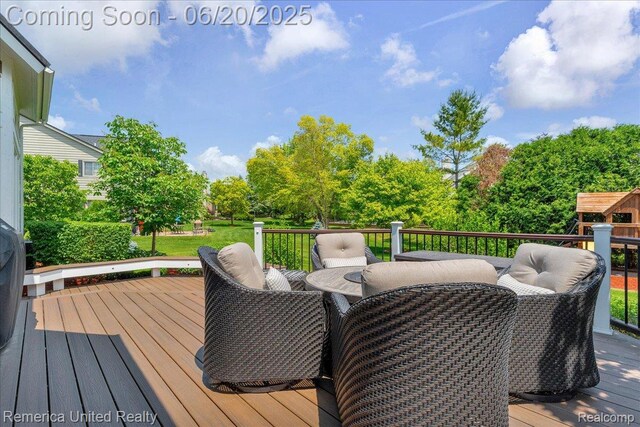 22858 Saint George Cir S, Lyon, MI 48178 - wooden deck featuring outdoor dining space and view of scattered trees