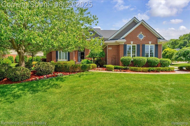 22858 Saint George Cir S, Lyon, MI 48178 - view of front of home featuring brick siding and a front lawn