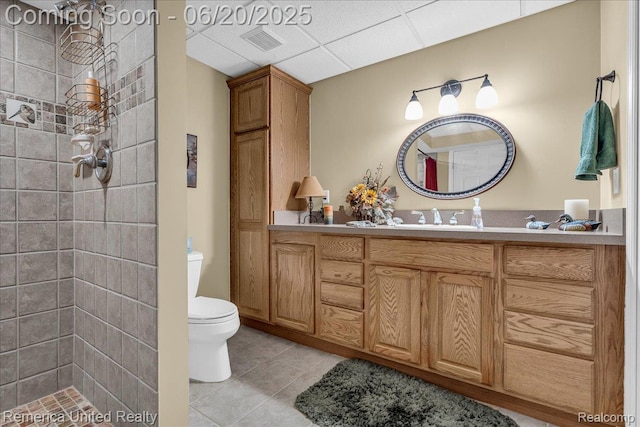 22858 Saint George Cir S, Lyon, MI 48178 - bathroom with tiled shower, vanity, tile patterned flooring, and a drop ceiling