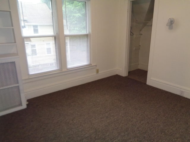 510 S Main, Mount Pleasant, MI 48858 - unfurnished bedroom featuring dark carpet and a closet