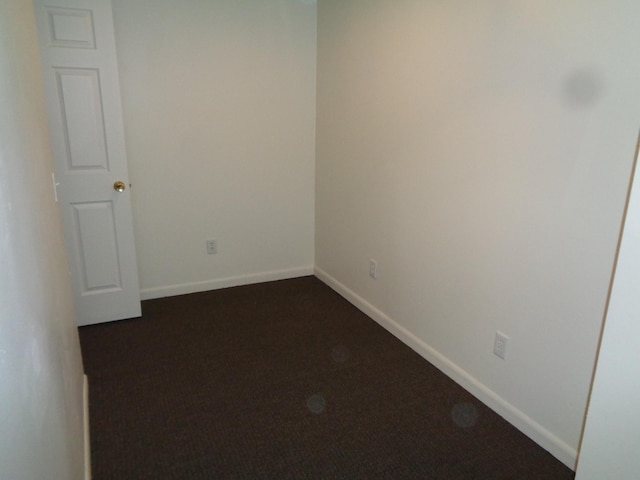 510 S Main, Mount Pleasant, MI 48858 - spare room featuring dark carpet and baseboards