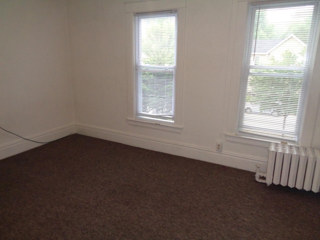 510 S Main, Mount Pleasant, MI 48858 - spare room with radiator and dark carpet