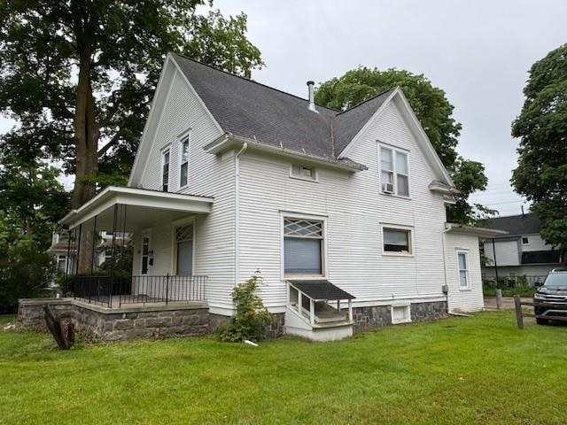510 S Main, Mount Pleasant, MI 48858 - rear view of house with a porch and a lawn