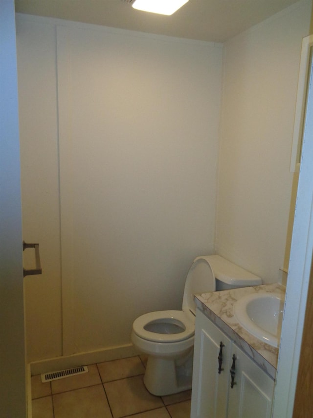 1014 S Lansing, Mount Pleasant, MI 48858 - half bathroom featuring toilet, tile patterned floors, and vanity