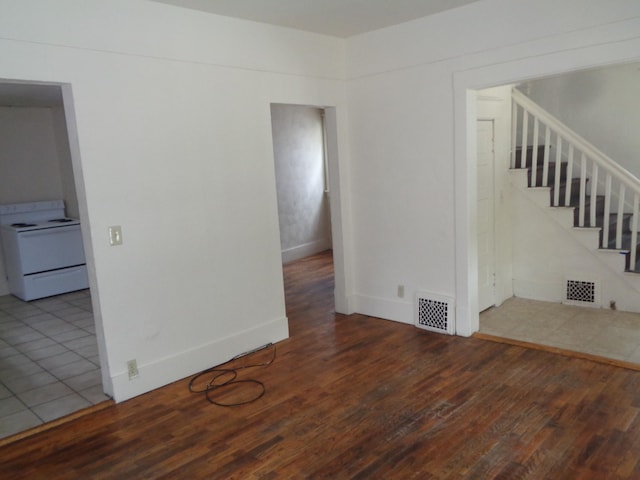 1014 S Lansing, Mount Pleasant, MI 48858 - spare room featuring wood finished floors, stairway, and baseboards