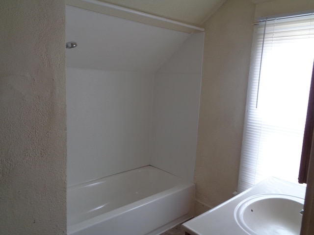 1014 S Lansing, Mount Pleasant, MI 48858 - full bath with lofted ceiling, a bath, and vanity