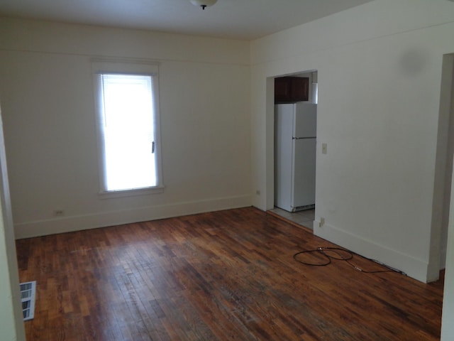 1014 S Lansing, Mount Pleasant, MI 48858 - unfurnished room featuring wood finished floors and baseboards