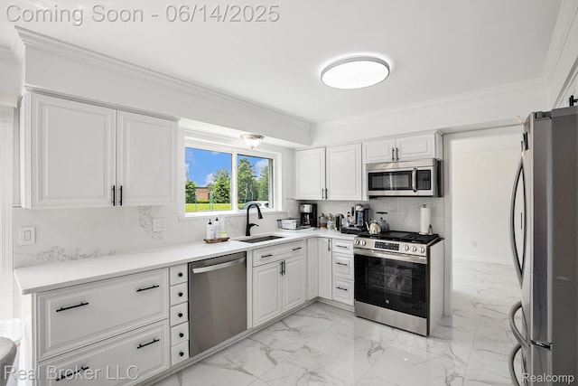 5582 Greenbriar Dr, West Bloomfield, MI 48322 - kitchen with stainless steel appliances, a sink, light marble finish floors, ornamental molding, and white cabinetry