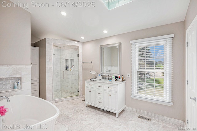 5582 Greenbriar Dr, West Bloomfield, MI 48322 - bathroom with vanity, a shower stall, a soaking tub, recessed lighting, and baseboards